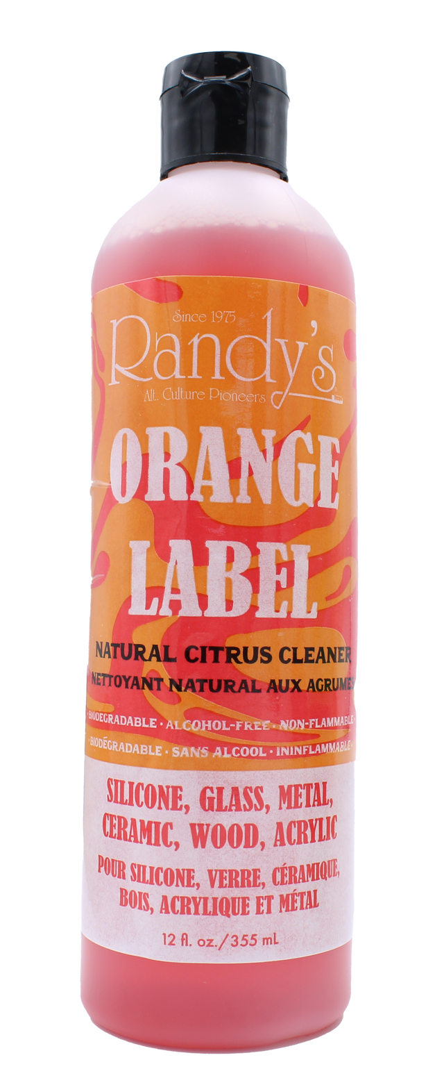 front view of the randy's orange label cleaner. made for silicone, glass, metal, ceramic, wood, and acrylic surfaces for a clean shiny finish for peak smoking experience.