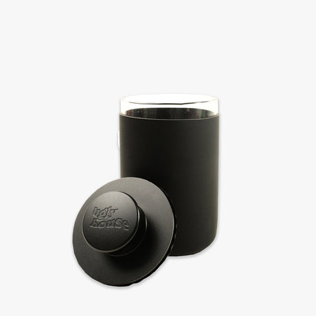 front view of the Ugly house stash air in black. A air sealed storage container made of high quality glass. A