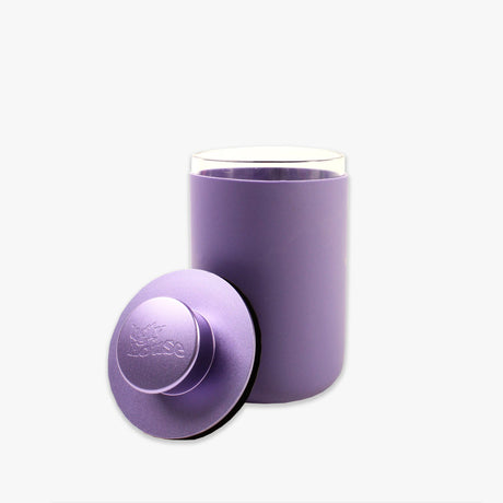 front view of the Ugly house stash air in purple. A air sealed storage container made of high quality glass.
