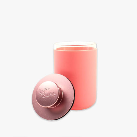 front view of the Ugly house stash air in rose gold. A air sealed storage container made of high quality glass.