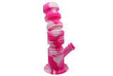 side view of the waxmaid springer silicone waterpipe in pink and white. a flexible and durable water pipe for perfect adjustment and convenience.