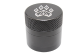 side close up view of the Wolf grinder 1.5" 4 piece grinder. Made of lightweight and durable aluminum. it is precisely made that provides a consistent shred with its sharp teeth while being portable. I ti made in a durable anodized black coloring.