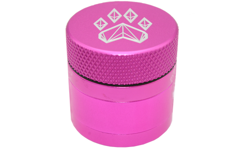 side close up view of the Wolf grinder 1.5" 4 piece grinder. Made of lightweight and durable aluminum. it is precisely made that provides a consistent shred with its sharp teeth while being portable. I ti made in a durable anodized pink coloring.