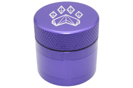 side close up view of the Wolf grinder 1.5" 4 piece grinder. Made of lightweight and durable aluminum. it is precisely made that provides a consistent shred with its sharp teeth while being portable. I ti made in a durable anodized purple coloring.