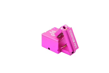 view of the wold grinders scorpion folding hand pipes. made of aircraft grade aluminum with a quartz bowl for performance smoking in a compact package finished in pink. able to be folded for carry and storage.