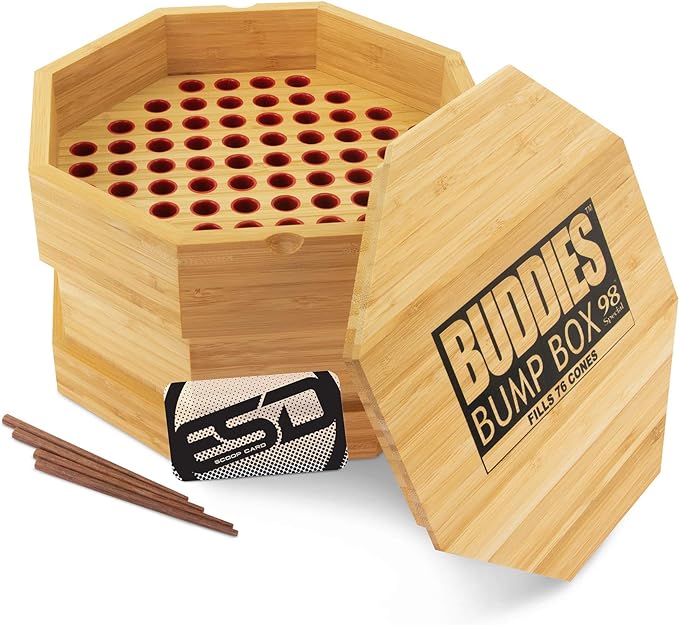 Top-down overhead view of the open Buddies Bump Box in natural light brown wood, revealing exactly 76 perfectly sized slots. Designed specifically for 98mm special size cones, users simply load the holes, spread their dry herb over the top, and efficiently fill bulk batches.