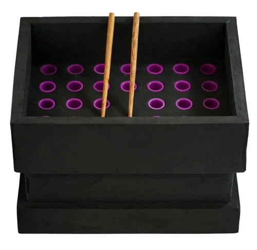 Front angled view of the Buddies Bump Box 1 1/4 Size 34-Cone Filler in sleek black. This heavy-duty, multi-cone filling machine allows dispensaries and mass producers to simultaneously pack up to 34 pre-rolled cones with ease and consistency.