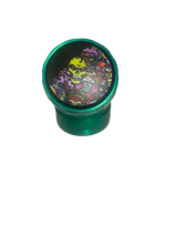 Top-down overhead view of the Chromium Crusher elbow spinner grinder in gunmetal grey. The transparent top window allows users to easily visually monitor their botanical blends during the grinding process while turning the ergonomic metal crank.