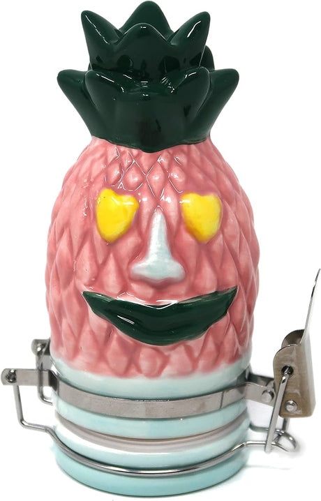 Front view of the Contained Art 100ml ceramic pineapple stash jar in white with vibrant printed artwork. This premium airtight container perfectly preserves the freshness of your dry herbs while completely blocking out harmful UV light.