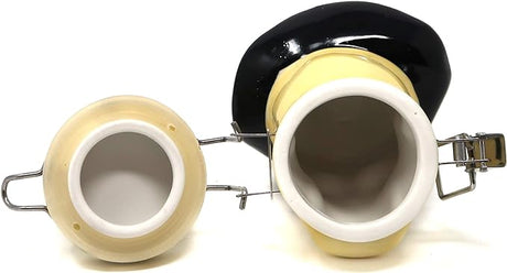 Angled overhead view of the Contained Art ceramic pirate skull stash jar in white with its fitted lid removed. Equipped with a thick silicone o-ring, this 100ml jar creates a highly effective smell-proof seal to lock in moisture and terpenes.