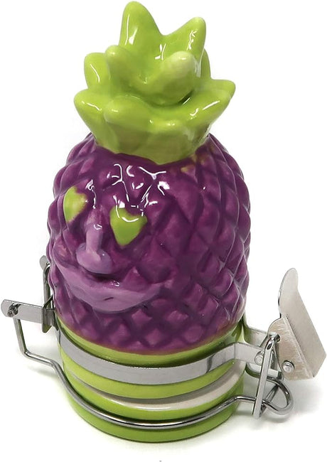 Front view of the Contained Art 50ml ceramic stash jar in white featuring a vibrant pineapple artwork design. This premium airtight container perfectly preserves the freshness of your dry herbs while completely blocking out harmful UV light.