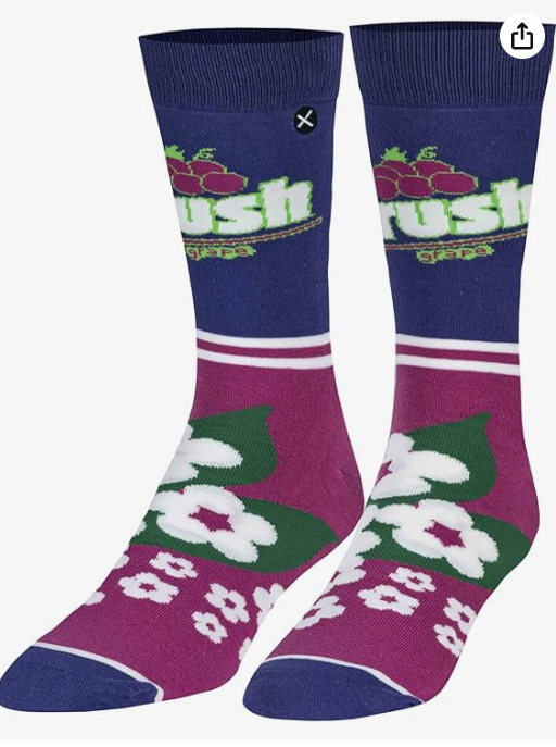 Front view of a pair of Crazy Socks featuring officially licensed Crush Soda graphics. These vibrant novelty crew socks showcase the classic white and blue brand logo text layered over a bright purple background to add a distinct pop to your outfit.