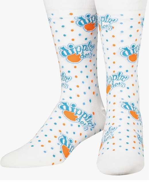 Front view of a pair of Crazy Socks featuring officially licensed Dippin' Dots graphics. These colorful novelty crew socks display rows of multi-colored ice cream beads against a bright blue and white background to add a playful pop to your daily outfit.