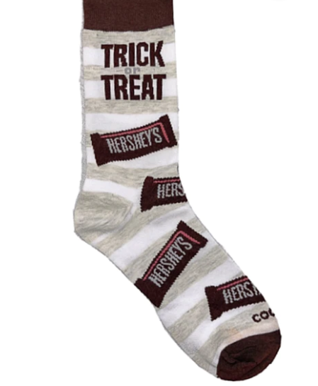 Front view of a pair of Crazy Socks featuring officially licensed Hershey's graphics. These vibrant novelty crew socks showcase the classic silver brand logo text layered over a rich chocolate brown background to add a distinct pop to your outfit.