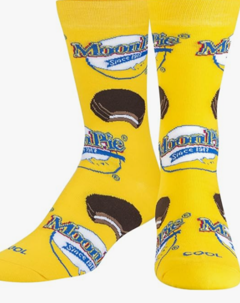Front view of a pair of Crazy Socks featuring officially licensed MoonPie graphics. These vibrant novelty crew socks showcase the classic yellow and blue brand logo text layered over a deep blue background to add a distinct pop to your outfit.