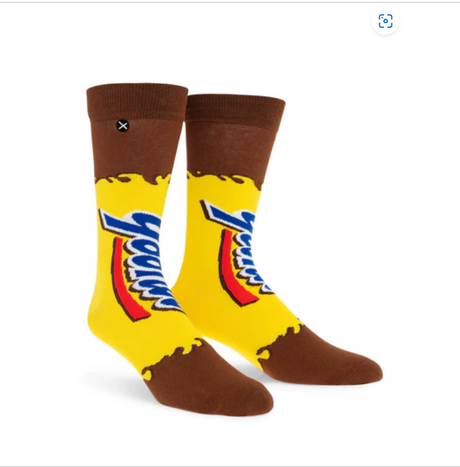 Front view of a pair of Crazy Socks featuring officially licensed Yoo-hoo Chocolate Drink graphics. These vibrant novelty crew socks showcase the classic yellow and blue brand logo text layered over a bright yellow and brown background to add a distinct pop to your outfit.