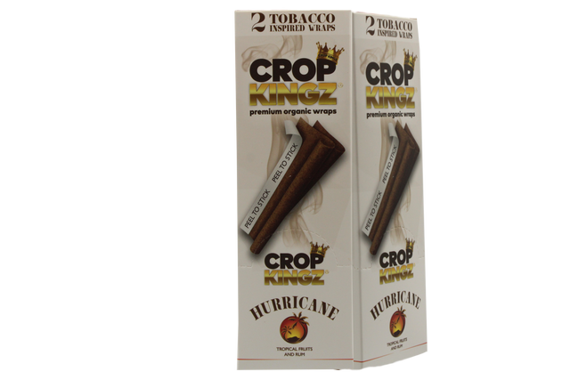 Front angled view of the Crop Kingz Tobacco Inspired Wraps 15-count display box in white and gold packaging. Made from 100% organic hemp, these tobacco-free wraps mimic the rich flavors of traditional blunts and feature an innovative self-sealing strip.