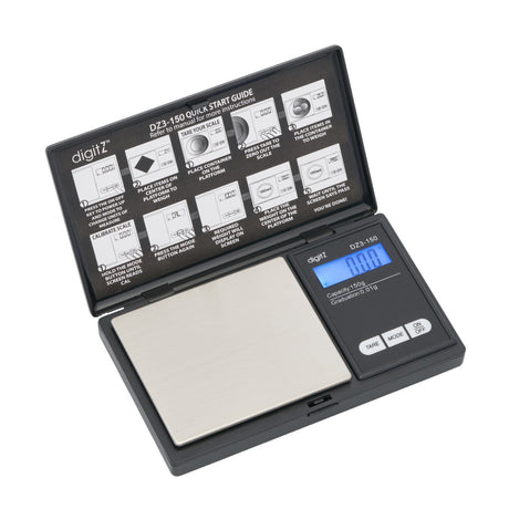 Angled overhead view of the DigiTz DZ3-150 measurement scale in black and silver. This highly precise 150g pocket scale features a stainless steel platform for accurately measuring concentrates, herbs, and small jewelry on the go.