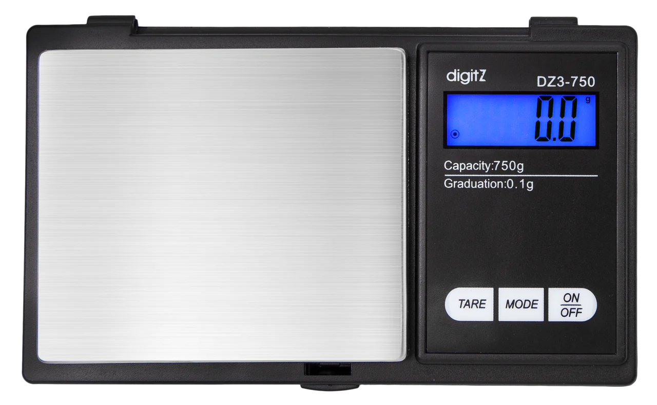 Angled overhead view of the DigiTz DZ3-750 measurement scale in black and silver. This compact 750g pocket scale features a stainless steel platform for accurately measuring larger quantities of herbs, concentrates, and small items on the go.