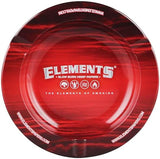 Top down view of the Elements Red Metal Ashtray in vibrant red with classic white logo branding. Measuring 5.5 inches in diameter, this durable metal tabletop accessory features three built-in indentations and a deep basin for catching ash and debris during your smoking sessions.