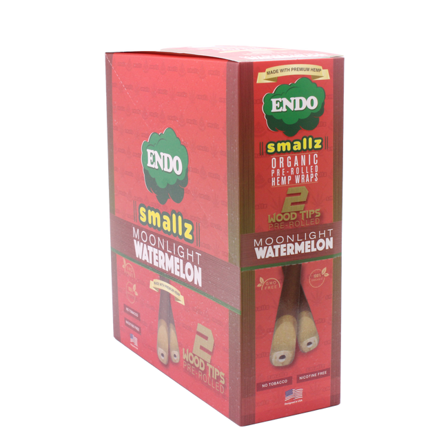 Front view of the Endo Smallz 15-count display box in Moonlight Watermelon featuring bright green and red colors. These compact funnels are constructed from unadulterated German hemp and capable of holding exactly one gram of ground material.