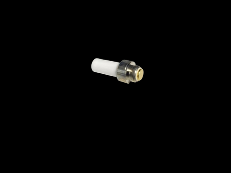 Angled overhead view of the Fly Fresh Trinity device equipped with the ceramic herb heater attachment in white and silver. This innovative coil acts as an electronic lighter to smoothly heat dry herbs without the need for an open flame.