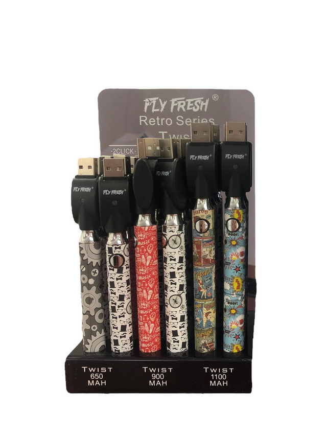 Angled front view of the Fly Fresh Twist 510 battery 24-count retail display box showing an assortment of retro colors. This counter-ready wholesale display features 24 slimline stick batteries with adjustable voltage designed for standard 510-thread oil cartridges.