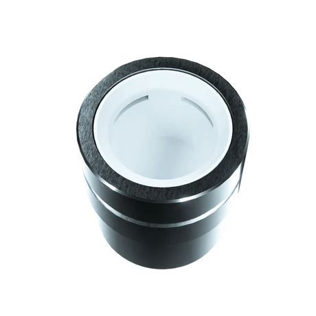 Top-down angled view into the Focus V Carta 2 Intelli-Core Wax Atomizer chamber in silver and white. The spacious quartz-coated ceramic bucket provides even heat distribution to maximize the flavor and vapor production of your extracts.