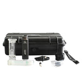 Angled overhead view of the complete G9 Greenlightvapes G-Dip vaporizer kit inside its elegant plastic travel case. This comprehensive dab set includes the device body, two vapor tips, glass bubbler, cleaning swab, silicone container, and a micro-USB charging cable.