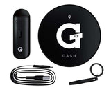 Angled overhead view of the complete G Pen Dash dry herb vaporizer standard kit laid out against a clean white background. This premium, travel-friendly flower starter set includes the main device, a convenient packing tool with a keychain, and a pass-through micro-USB charging cable.