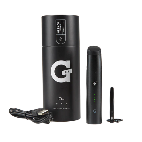Overhead spread view of the G Pen Pro Dry Herb Vaporizer Kit in black, arranged alongside its included accessories. The complete kit includes the vaporizer, a USB charging cable, cleaning brush, packing tool, and a signature G-card grinder for ultimate convenience.