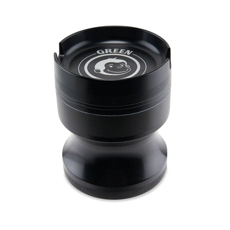 Angled view of the Green Monkey Chacma grinder in deep purple. This durable 63mm 4-piece zinc alloy grinder features a chalice-style shape and a built-in ashtray on the lid for convenience.