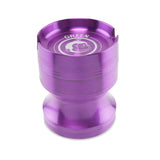 Angled view of the Green Monkey Chacma grinder in deep purple. This durable 63mm 4-piece zinc alloy grinder features a chalice-style shape and a built-in ashtray on the lid for convenience.