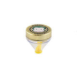 Front profile view of the Green Monkey Patas 50mm funnel grinder in sleek matte gold. This innovative metal herb grinder features a built-in dispensing funnel for completely mess-free loading of your cones and glass bowls.