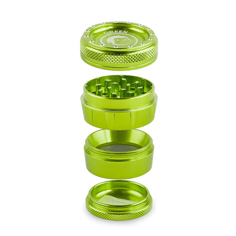 Angled overhead view of the Green Monkey Tamarin 50mm grinder in green, fully disassembled to showcase its four-piece construction. This durable grinding accessory includes a magnetic top, a sharp grinding chamber, a deep flower storage catch, and a fine mesh pollen screen.