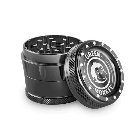 angled front profile view of the Green Monkey Tamarin 50mm grinder in metallic black. This premium 4-piece aluminum herb grinder features a strong magnetic lid for secure, effortless shredding of your favorite dry herbs.