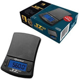 Angled view of the Jennings JZ Digital Scale in black with its translucent smoky grey rubber cover closed. This form-fitting, impact-resistant cover safeguards the delicate weighing platform and buttons from dust and damage during travel.