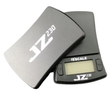 Angled overhead view of the Jennings JZ230 scale in black and silver, shown open. This pocket-sized digital scale features a protective cover that doubles as an expansion tray for accurately measuring dry herbs and concentrates.