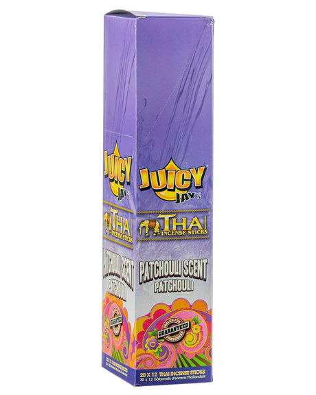 Front view of the Juicy Jay's Thai Incense Sticks 12-pack display in Patchouli flavor. This folding retail carton contains twelve sleeves of highly concentrated, slow-burning incense designed to effectively manage ambient odors.