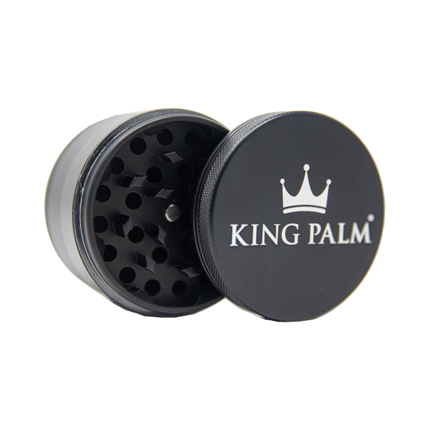 Front view of the King Palm 62mm aluminum herb grinder in sleek matte black. This premium 4-piece metal grinder features a strong magnetic lid and sharp diamond-shaped teeth to effortlessly shred dry herbs for your palm leaf rolls.