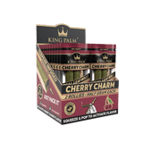 Front view of the King Palm Flavored Rollies 20-count display box in bright pink packaging. Holding 0.5 grams of dry herb each, these tobacco-free natural leaf cones feature a squeeze-and-pop flavor bead in the filter for a customized smoke.