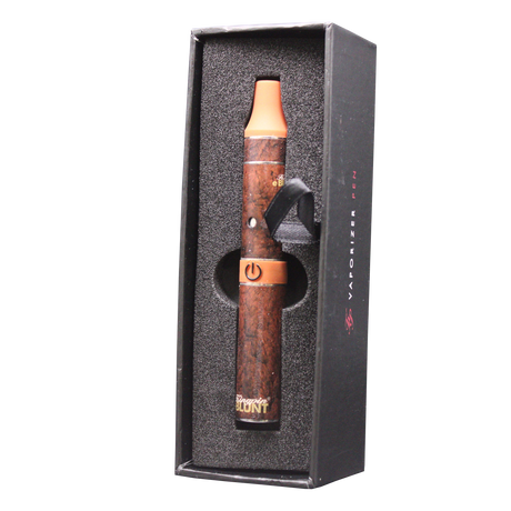 Top down overhead view of the complete Kingpin e-Rillo electronic cigarillo kit in brown and gold accents. This wholesale setup includes the pen battery, specialized atomizer chamber, cleaning brush, and a custom wireless USB charger for convenient power ups.