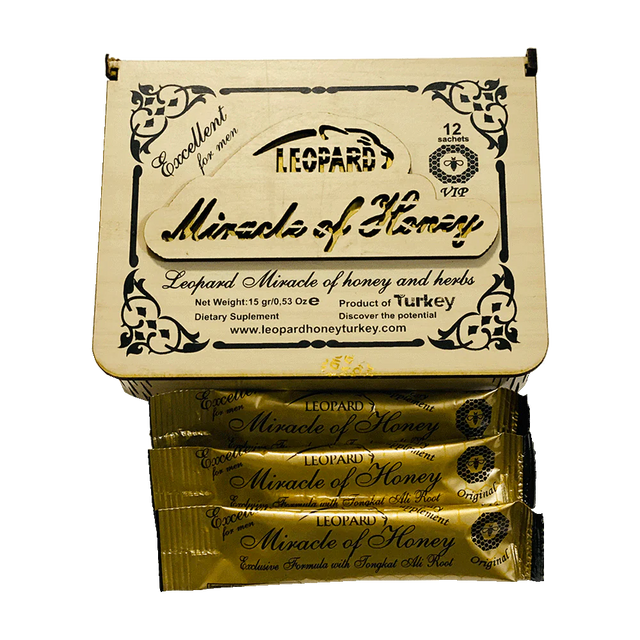 Angled overhead view of the Leopard Miracle Royal Honey retail display box featuring matching black, gold, and leopard print artwork. This professional wholesale countertop display container holds multiple individual honey sachets for convenient presentation and dispensing in retail environments.
