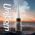 Front view of the Lookah Unicorn Mini electric dab rig in vibrant silver. This ultra-portable, compact e-rig features a unique cone-shaped glass bubbler and a 950mAh battery for smooth concentrate sessions on the go.