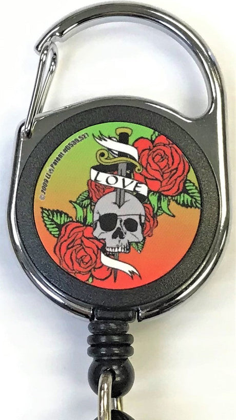 Front facing view of the Merchants Lighter Leash Tattoo Series Holder displaying an assortment of roses with skull, sword and banner. This highly practical retail companion accessory clips securely to belt loops, keys, or pockets to ensure consumers never lose their lighter.