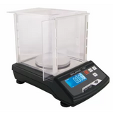 Angled overhead view of the My Weigh iBalance i101 measurement scale in white and silver. This ultra-precise 100g x 0.005g scale features a stainless steel platform for professional-grade weighing of gems, jewelry, or laboratory materials.