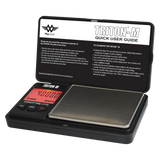 Angled overhead view of the My Weigh Triton T2 digital mini scale in black. This compact 400g x 0.01g pocket scale features a durable ribbed outer casing for precise, everyday weighing of herbs, concentrates, and small jewelry.
