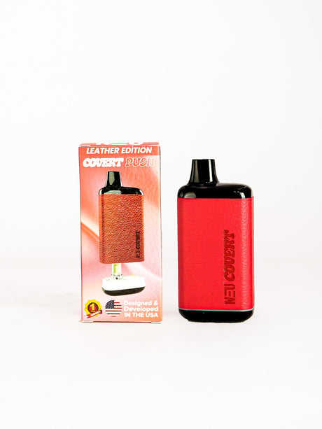 Front facing view of the NEU Push Covert Discreet Battery in matte red. This stealthy 650mAh concealed cartridge battery completely hides your 510-threaded oil tanks within its chassis for ultimate privacy on the go.