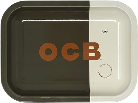 Front view of the small OCB metal rolling tray in a sleek black finish featuring the iconic white OCB Premium logo script across the center. This durable 7.5×5.5-inch aluminum accessory provides an ultra-smooth surface for cleanly breaking down and rolling custom papers.