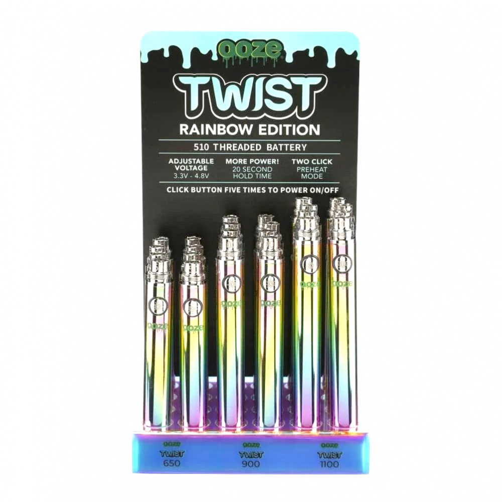 Front view of the Ooze 510 battery 24-count retail display filled with rainbow metallic vape batteries. This retail-ready wholesale acrylic display provides smoke shops with a highly popular, eye-catching setup perfect for checkout counters.